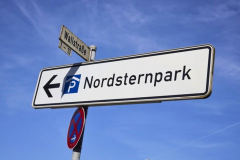 Signpost to Nordsternpark in front of a blue sky in Gelsenkirchen, Ruhr area, independent city,