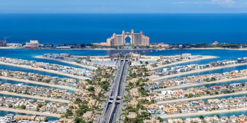 The Palm Jumeirah with Atlantis Hotel artificial island panorama from above in Dubai, United Arab
