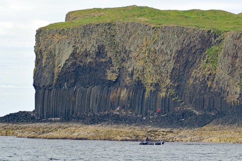 A coastline with prominent basalt cliffs and green grassland above, Hebridean Overture, Isle of