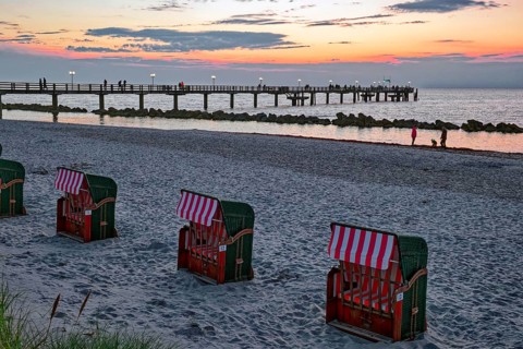 Abandoned beach chairs, Baltic Sea beach, Baltic Sea coast with the Wustrow pier, evening mood,