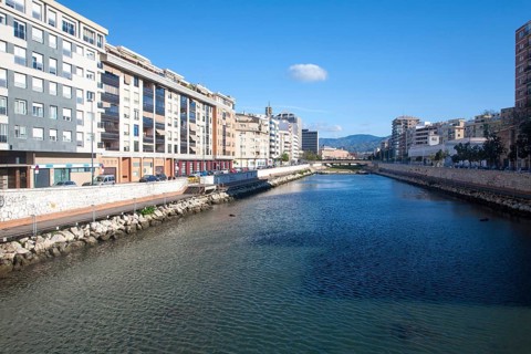 Straightened walled canalised channel of Rio Guadalmedina river, Malaga city centre, Spain, Europe