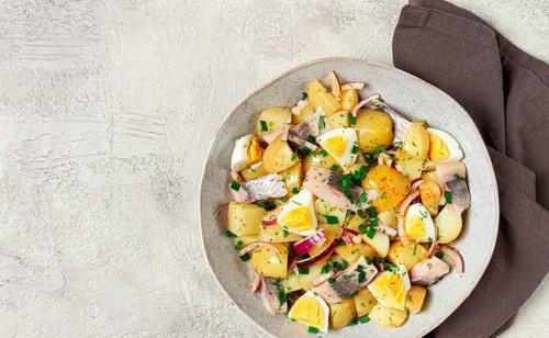 Potato salad with herring and eggs, Scandinavian cuisine, homemade, no people