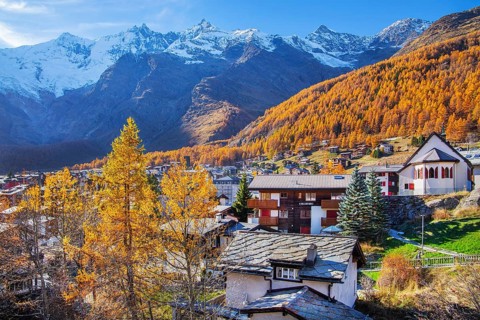 View of the village with Dom 4545m and Täschhorn 4491m of the Mischabel group in autumn, Saas-Fee,