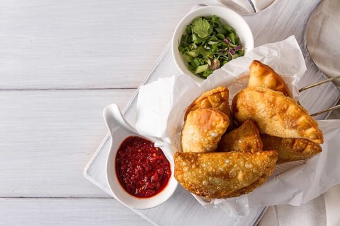 Fried chebureks, close-up, on a white background, no people