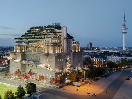 Aerial view of the Hamburg Bunker with green terraces and modern architecture in the evening