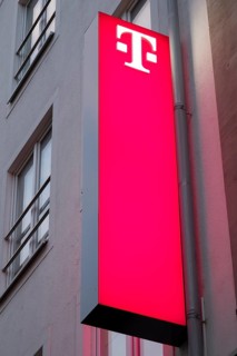 Telekom, facade with sign and logo, illuminated, Essen, Ruhr area, North Rhine-Westphalia, Germany,