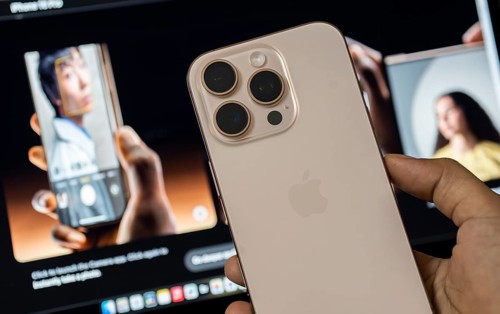 A person holding an iphone 16 series device at an apple premium reseller store, as iPhone 16 series