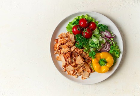Gyros, chicken, with vegetables on plates, disassembled shawarma, fast food, appetizer, cooking