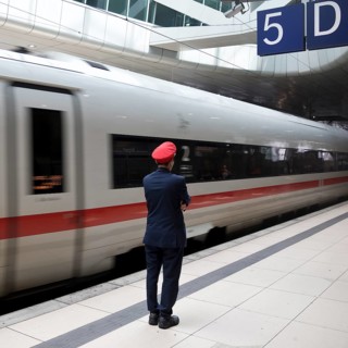 ICE at the centre platform with Deutsche Bahn staff, long-distance train station, airport,
