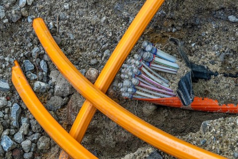 Laying of fibre optic cables, empty conduits are laid under a pavement, in which the actual fibre