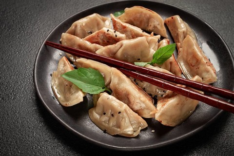 Japanese fried dumplings, gyoza, sesame seeds, top view, no people