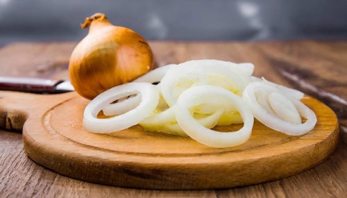 Vegetables, onion, Allium cepa, freshly cut onion rings on a wooden board, Studio