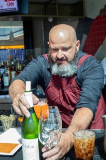 Denver, Colorado, Workers at bar dough, an airport restaurant and bar, serve travelers at Denver
