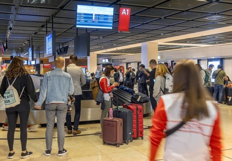 Berlin-Brandenburg BER Airport. Passengers waiting for their suitcases at baggage reclaim. Berlin,