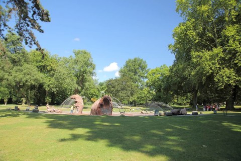 Water spray field, ornamental fountain with sculptures in the park Günthersburgpark, park,