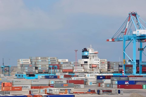 Crane loading of a container ship at the container terminal in the port of Zeebrugge, Belgium,