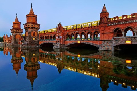 Oberbaum Bridge over the Spree with yellow underground in the early morning,