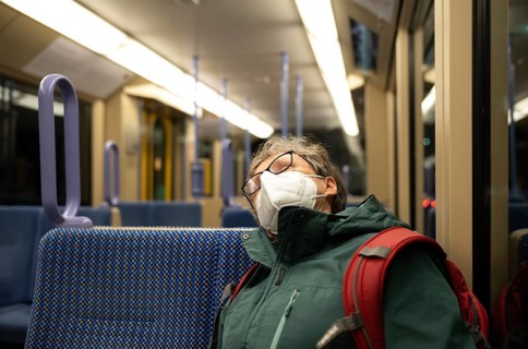 Older woman with mouth mask, sleeping, sitting in underground, Corona crisis, Stuttgart,