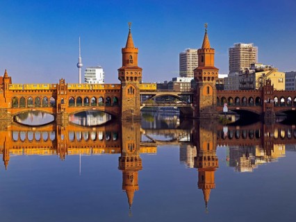 Oberbaum Bridge over the Spree with yellow underground and television tower,