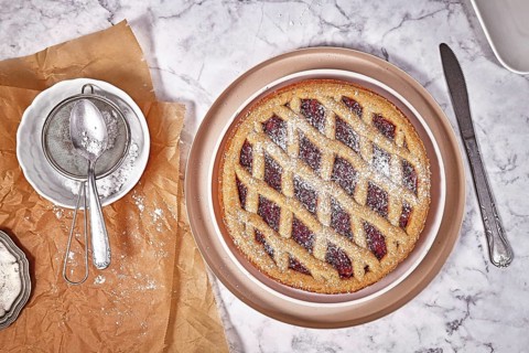 Top view of pie called 'Linzer Torte', a traditional Austrian shortcake pastry topped with fruit