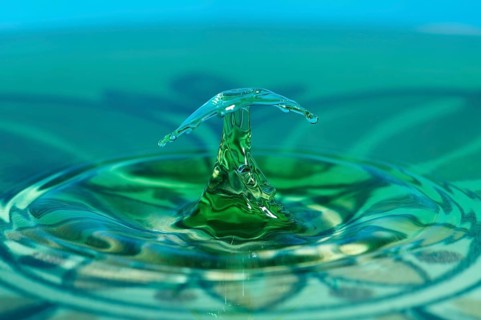 Water crystal, highspeed photography of drops of a water column hitting a water surface, studio