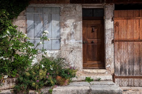 Old house façade with door and window, Moustiers-Sainte-Marie, Département Alpes-de-Haute-Provence,