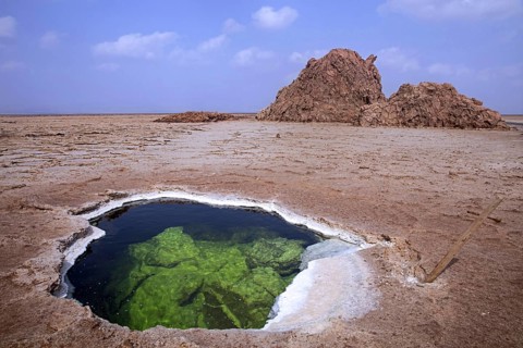 Lake formed in hole in salt layer in desert of the Danakil Depression, lowest and hottest place on