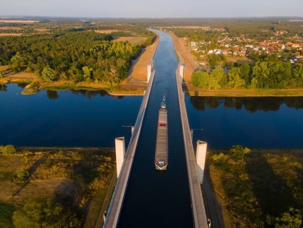Drone shot, cargo ship on the Mittelland Canal, Magdeburg waterway junction, canal bridge,