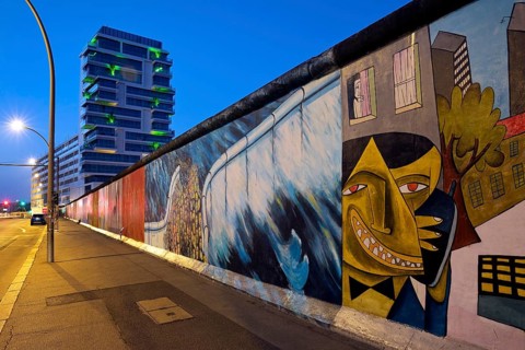 East Side Gallery in the early morning, mural by artist Jim Avignon and friends and Kani Alavi,