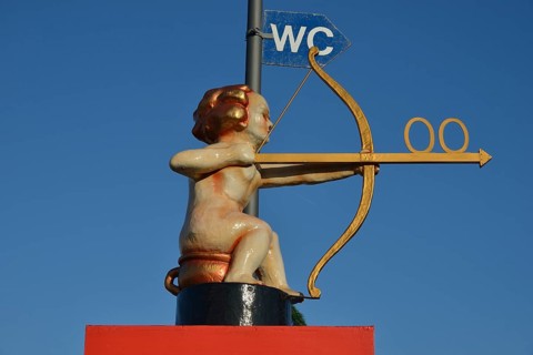 Archer Cupid as a toilet sign, Oktoberfest, Munich, Upper Bavaria, Bavaria, Germany, Europe