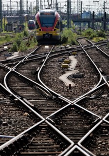 Track apron with rails, infrastructure and a local train at the main railway station, Frankfurt am