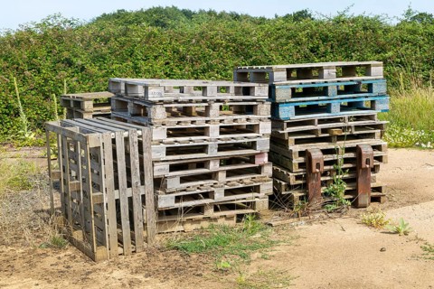 Pile of wooden pallets stacked up, Sutton, Suffolk, England, UK
