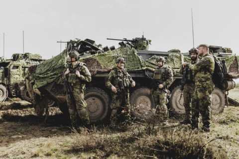 Soldiers in front of a Pandur II 8x8 of the Czech army, taken during an exercise of the Bundeswehr
