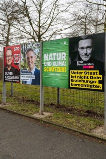Board with election posters, SPD, CDU, Bündnis90 Die Grünen, FDP, Bundestag election 2025, Kamen,