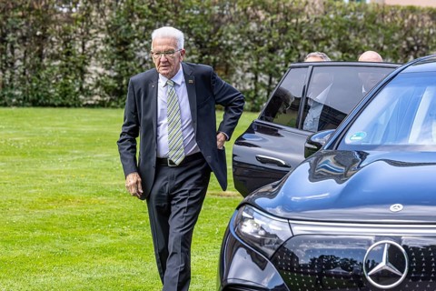 Winfried Kretschmann, Prime Minister, Green Party. Getting out of his official Mercedes car, in