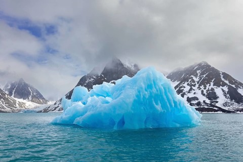 Iceberg melting in summer in Magdalenefjorden, fjord in Albert I Land on Svalbard, Spitsbergen,