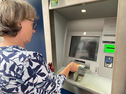 Elderly woman at EC cash machine, BW-Bank, Baden-Württembergische Bank, withdraws cash, EURO,