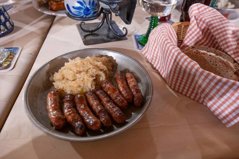 Nuremberg sausages with sauerkraut served on a pewter plate, Nuremberg, Middle Franconia, Bavaria,
