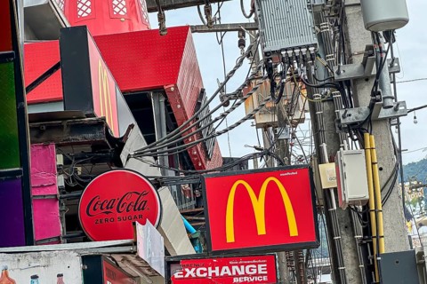 Coca Cola and McDonald's: American food companies are active worldwide. Logos of the brands on