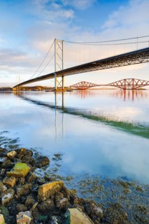 View of the Forth Road Bridge and the red railway bridge Forth Bridge at the Fírth of Forth estuary