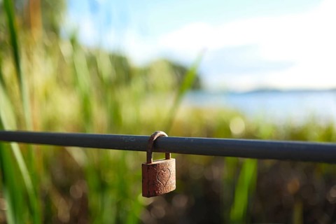 Love lock with heart at a lake, blurred background, Bad Saarow, Brandenburg, Germany, Europe