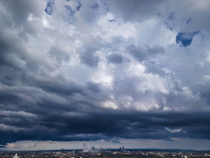 Heavy rain clouds pass over Frankfurt am Main and the banking skyline. The weather is expected to