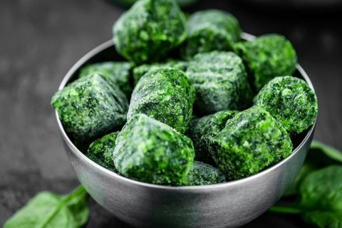 Frozen spinach cubes as detailed close up shot (selective focus)