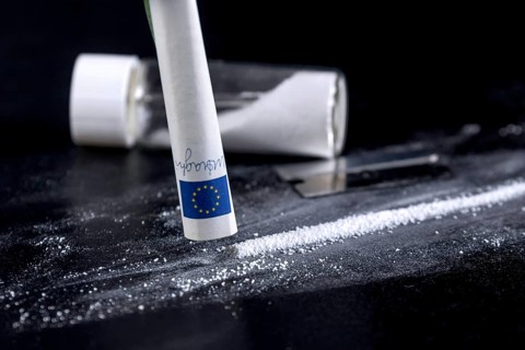 Cocaine Sniffing Closeup, Rolled Banknote for Snorting Line of Cocaine, Cocaine Drug Addiction