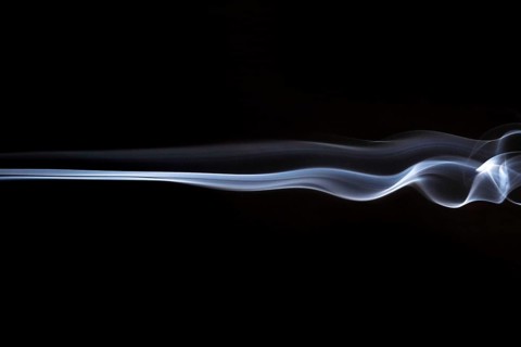 White smoky swirls abstract black background