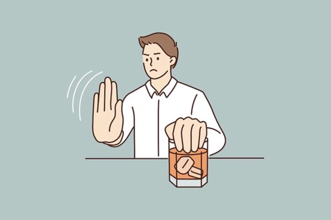 Young man refuse drinking alcohol. Decisive male make hand gesture sign say stop no to alcoholic