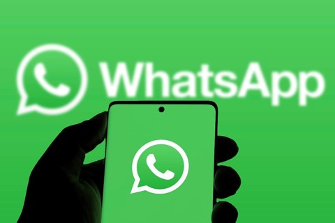 WhatsApp logo is displayed on smartphone.