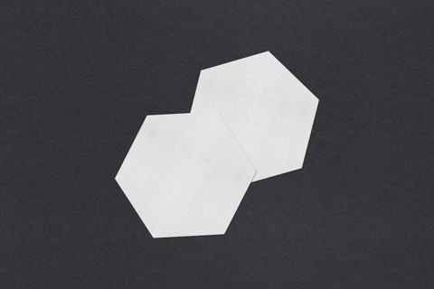 Two white hexagon shapes overlapping on a dark background, Blank white Business card mockup stacks