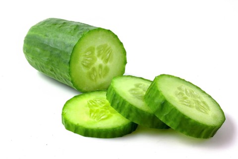 Cucumber and slices isolated on white background