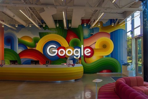 Google sign on the wall behind the reception desk at the Google headquarters in Silicon Valley